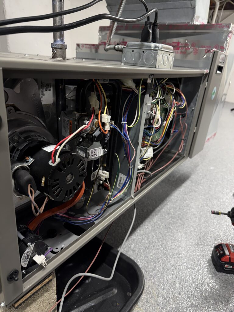 HVAC technician repairing a furnace in a Chicago home crawl space for safe and efficient heating