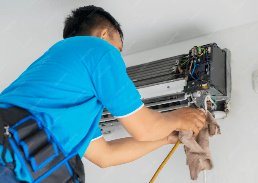 HVAC technician performing AC tune-up and maintenance in a Chicago home for efficient cooling
