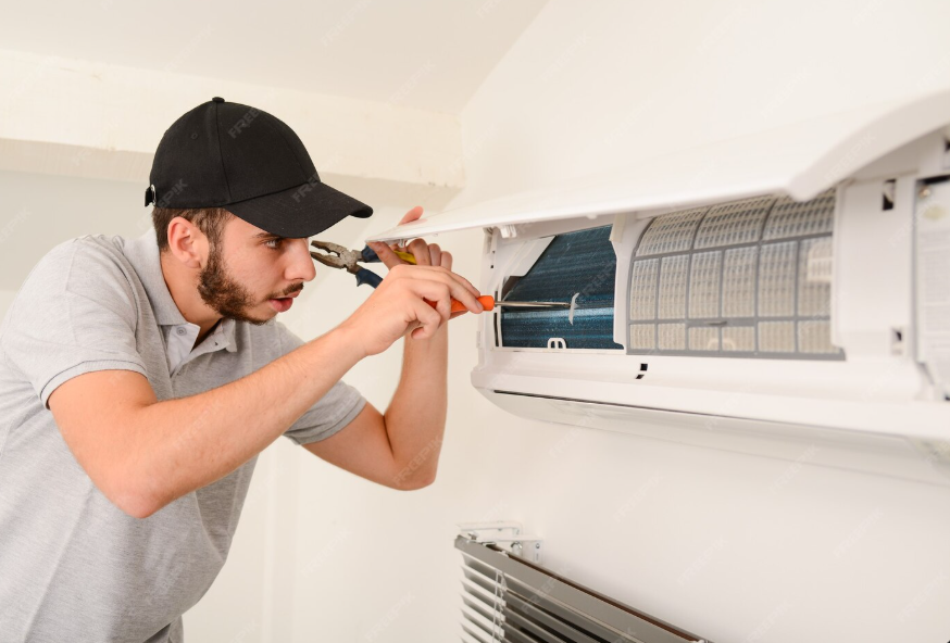 HVAC technician performing emergency air conditioner repair in a Chicago home