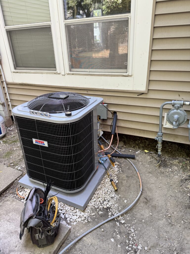 HVAC technician performing AC repair in a Chicago home to restore efficient cooling