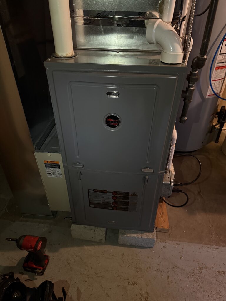 HVAC technician performing emergency furnace repair in a Chicago home for fast 24/7 heating service